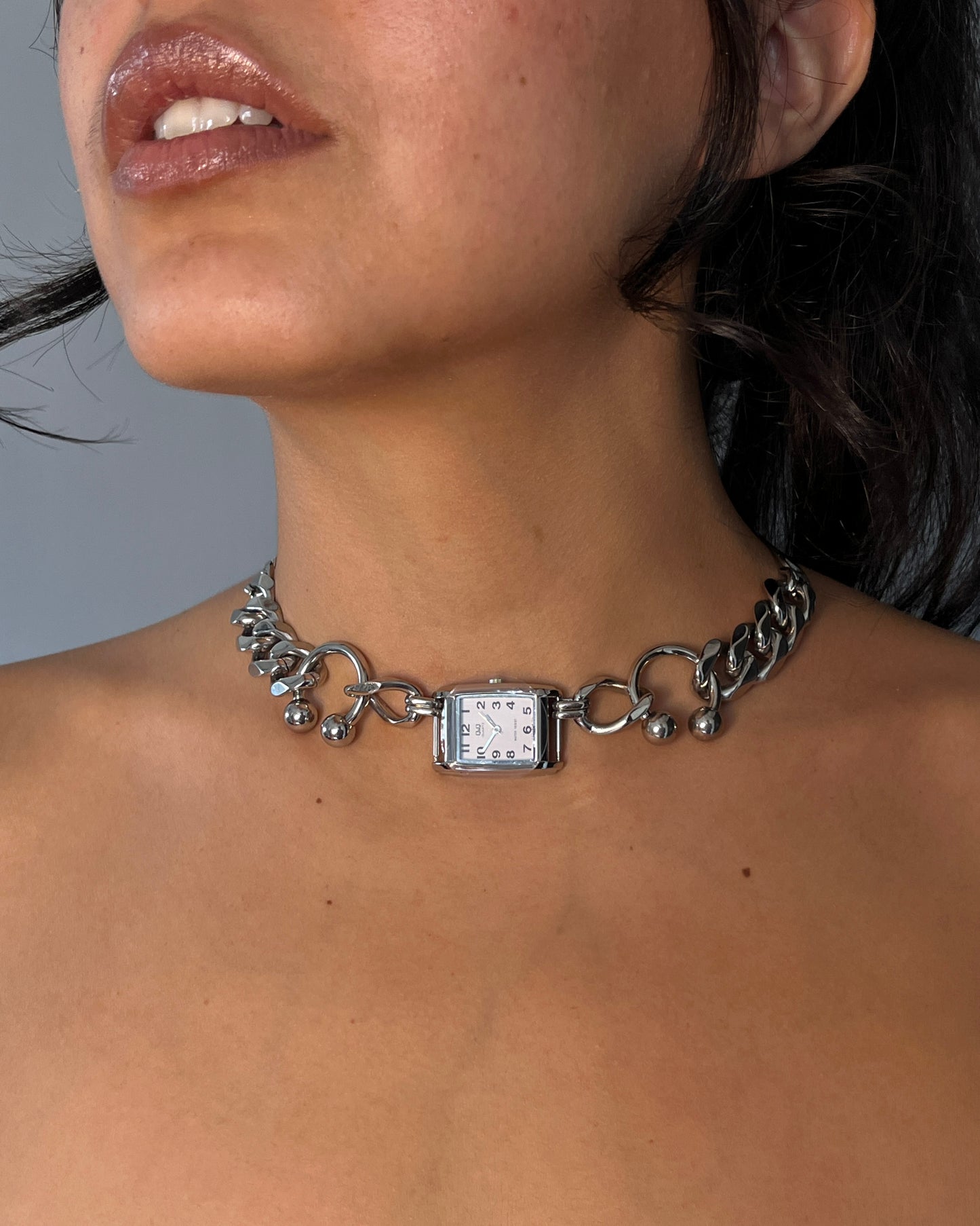 collar reloj piercing XXX